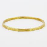 A heavy hallmarked 15ct yellow gold bangle, inner dia. 7.5cm.