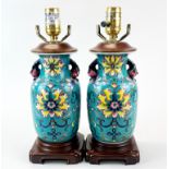 A pair of Chinese enamelled porcelain vases mounted as table lamps, H. 34cm.
