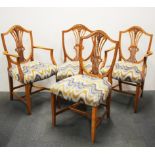 A set of four lyre back re-upholstered dining chairs.