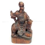 A Chinese carved hardwood figure of a lucky god, H. 34cm.