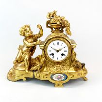 A 19th century French gilt bronze mantle clock with Sevres style porcelain panel, H. 28cm.W. 34cm.
