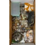 A box of mixed coins and notes.