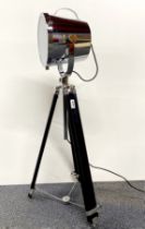 A contemporary search light style lamp on an adjustable tripod base, lowest H. 93cm.