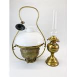 A brass hanging oil lamp and shade H. 59cm. together with a freestanding oil lamp and chimney.