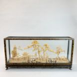 A mid 20th century complex Chinese cork carving in purpose made glass cabinet, 59 x 28 x 10cm.