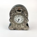 A hallmarked silver and leather covered mantle clock with quartz movement, H. 16cm.