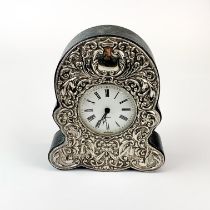 A hallmarked silver and leather covered mantle clock with quartz movement, H. 16cm.