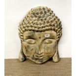 A wall mounted composition Buddha head, H. 56cm.
