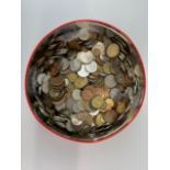 A tin of mixed coins.