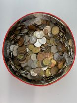 A tin of mixed coins.