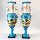 A pair of impressive large continental porcelain urns with griffon handles, H. 62cm.