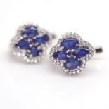 A pair of 925 silver earrings set with oval cut sapphires and white stones, L. 1.3cm.