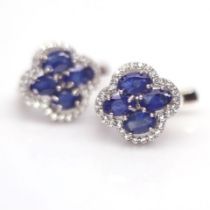 A pair of 925 silver earrings set with oval cut sapphires and white stones, L. 1.3cm.