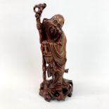 A Chinese craved hardwood figure of Shou Lao c. 1900, H. 27cm.