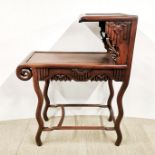 A Chinese carved hardwood two tier side table, 91 x 70 x 31cm. A/F to leg support.