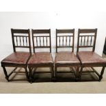 A set of four carved and turned mahogany upholstered dining chairs.