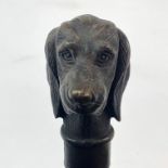 A bronze dog head walking stick, L. 86cm.