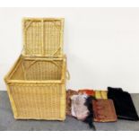 A cane linen box and a quantity of pashminas and other accessories.