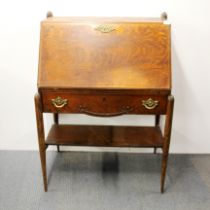 An unusual Edwardian Arts and Crafts oak bureau, H. 107 W. 77cm.