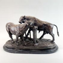 A large bronze figure of a bull and cow on a marble base after Mene, L. 50cm, H. 30cm.