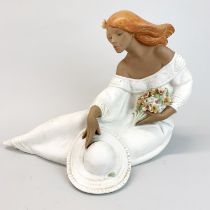 A large Lladro porcelain figure of a young woman with a bouquet of flowers, L. 35cm, H. 26cm. Very