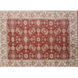 An Ottoman style red ground Eastern wool rug, 200 x 140