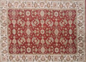 An Ottoman style red ground Eastern wool rug, 200 x 140