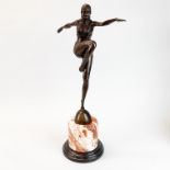 A large Art Deco style figure of a dancer on a marble base, H. 54cm.