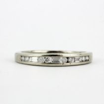 A 9ct white gold ring set with baguette and brilliant cut diamonds, (N).