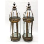 A pair of large gilt metal and glass storm lanterns, H. 80cm.