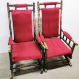 A pair of turned oak red upholstered rocking chairs, H. 105cm.