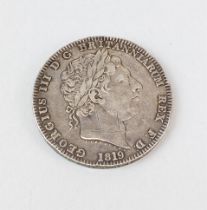 An 1819 silver crown.