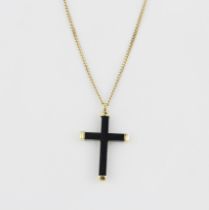 An 18ct yellow gold and carved wooden cross pendant, on an 18ct yellow gold chain, L. 51cm.