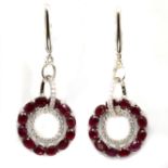 A pair of 925 silver drop earrings set with oval cut rubies and white stones, L. 4.8cm.