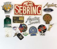 A collection of mixed vintage car badges etc. including Cambridge University, Austin seven, MGB