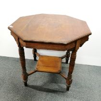 An octagonal, two-tier occasional table with turned wooden legs, H. 67cm W. 75cm.