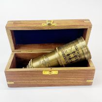 A boxed reproduction brass telescope, closed L. 15cm.