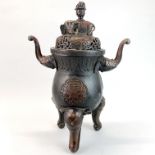 A superb large Chinese bronze censer with elephant head feet and handles, H. 51cm, W. 37cm.
