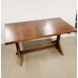 A stained wooden dining table, 141 x 72 x 77cm.