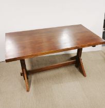 A stained wooden dining table, 141 x 72 x 77cm.