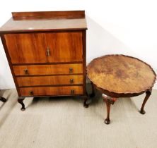 An early 20th century mahogany cabinet together with an early 20th century circular coffee table,