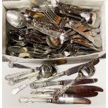 A large quantity of stainless steel cutlery.
