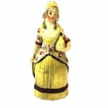 A rare 18th century hand painted erotic pottery figure of a woman (A/F), H. 19cm.