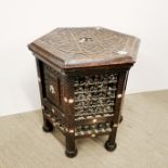 An eastern carved hardwood and mother of pearl inlaid octagonal occasional table, H. 48cm Dia. 41cm.