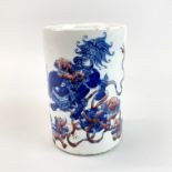 An early 20th century Chinese porcelain brush pot with blue and red underglaze decoration, H. 15.