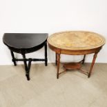 An oval shaped mahogany table with cross banded and inlaid decoration to top, L. 76cm H. 60cm W.