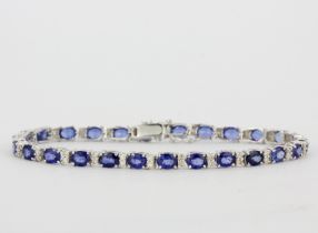 An 18ct white gold bracelet set with oval cut sapphires and diamonds, diamond approx. 0.61ct