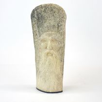 A carved whale bone head of a bearded gentleman, H. 27cm.