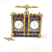 A bronze and enamelled double clock barometer, H. 13cm, W. 13cm.