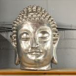 A large silvered composition Buddha head, H. 47cm.